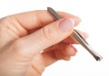 woman-holding-tweezers.jpg